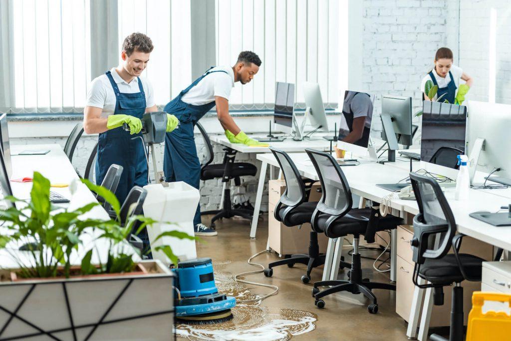 Commercial cleaning crew cleaning office